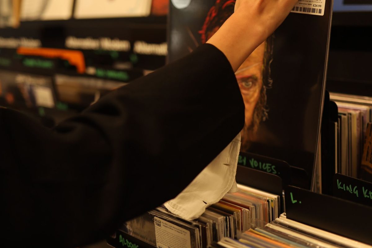 Flicking through records in a record shop