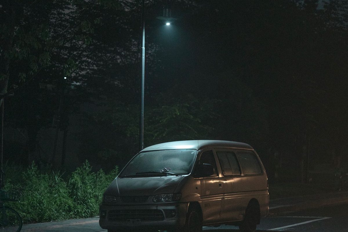 A van on a dark road
